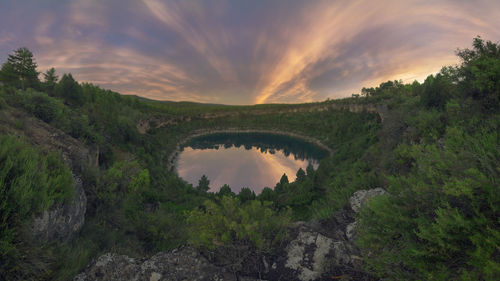 Scenic view of lake against sky during sunset