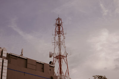 Low angle view of communications tower against sky