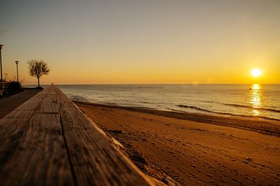 Scenic view of beach against sky during sunset