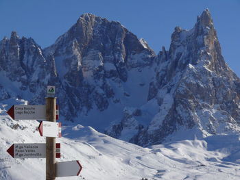 Scenic view of snow covered mountains against sky