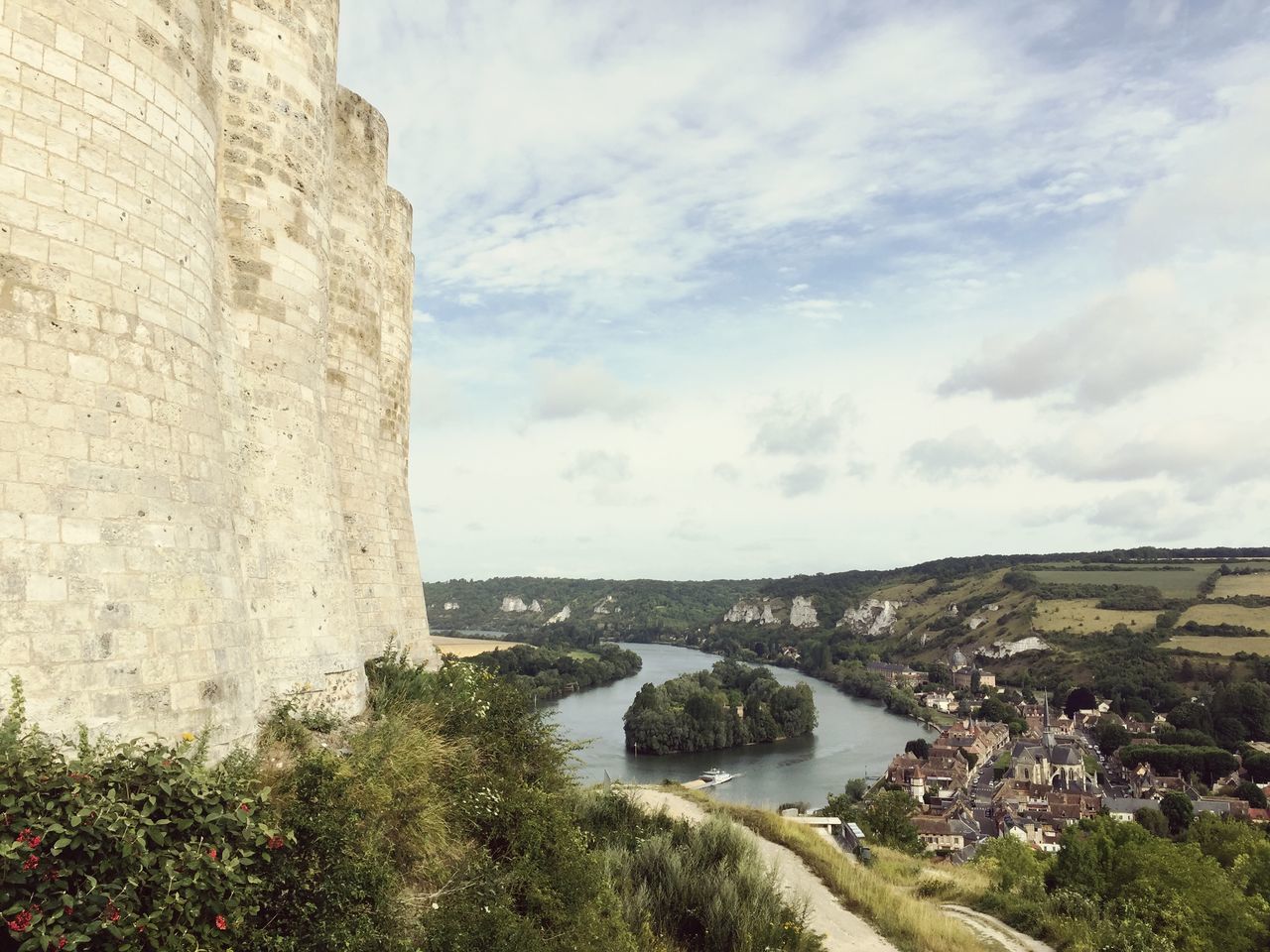 architecture, built structure, building exterior, sky, water, cloud - sky, sea, cloud, cloudy, river, nature, high angle view, day, tree, city, residential building, residential structure, outdoors, house, rock - object