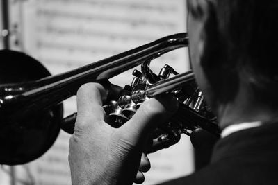 Midsection of man playing trumpet