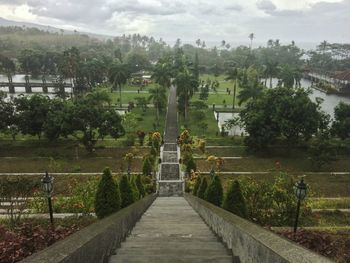 Scenic view of field against cloudy sky