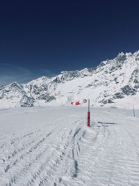 Scenic view of snowcapped mountain against clear sky