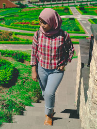 Woman walking on steps in public park