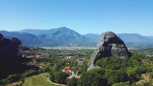 Scenic view of mountains against clear blue sky