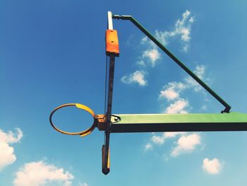 Low angle view of sign against sky