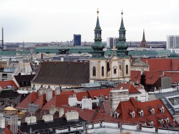 High angle view of buildings in city against sky