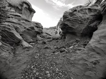 Low angle view of rocks against sky