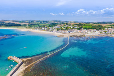 High angle view of swimming pool by sea against sky