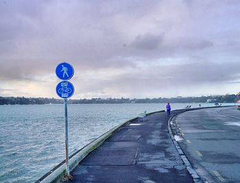 Road against cloudy sky