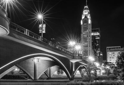 View of illuminated street and buildings at night