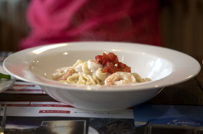 Close-up of shrimp with spaghetti served in bowl on table