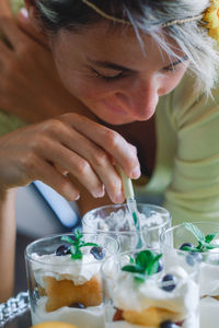 Close-up of woman eating dessert