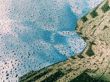 Full frame shot of water on landscape against sky