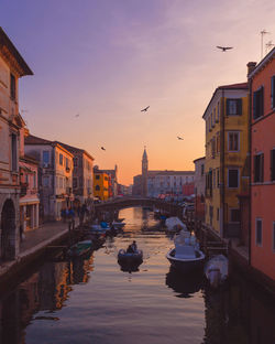 Canal amidst buildings in city