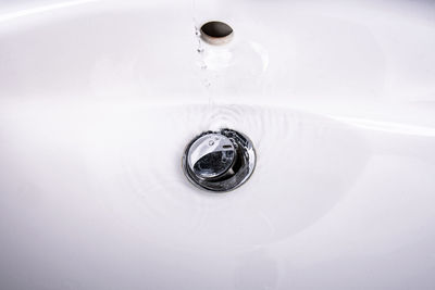 High angle view of water from faucet in bathroom