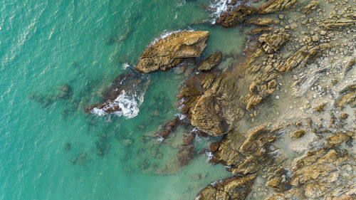 High angle view of rock formation in sea