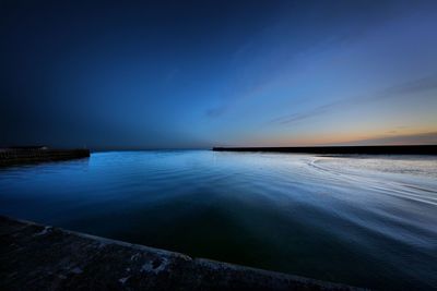 Scenic view of sea against sky at sunset