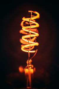 Close-up of illuminated light bulb