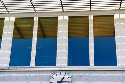 Low angle view of swimming pool against building