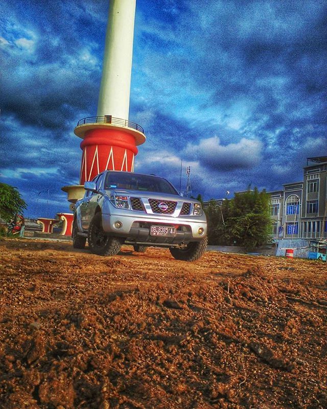 transportation, sky, mode of transport, cloud - sky, land vehicle, cloudy, car, cloud, built structure, architecture, building exterior, stationary, travel, weather, road, overcast, outdoors, street, day, on the move