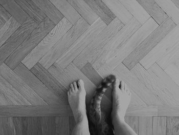 Low section of woman standing on tiled floor