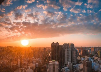 Cityscape against sky during sunset