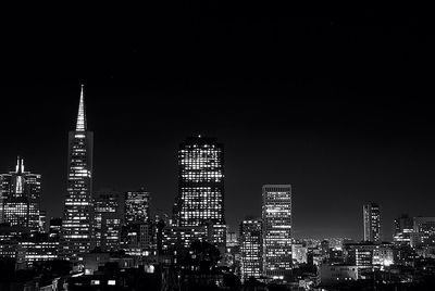 Low angle view of modern buildings at night