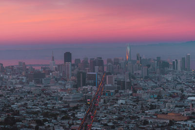Cityscape against sky during sunset