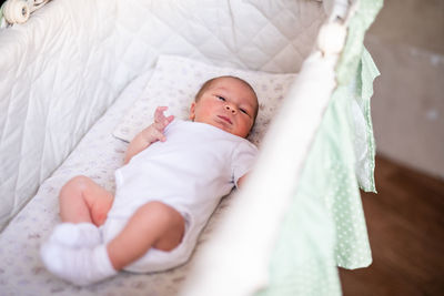 High angle view of cute baby sleeping