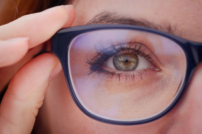 Close-up portrait of woman with reflection