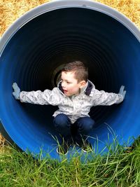 Portrait of cute boy in grass