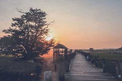 Scenic view of pier against sky during sunset