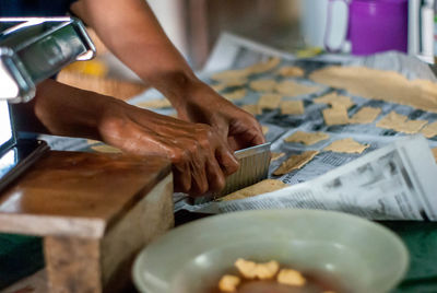 Close-up of man preparing food