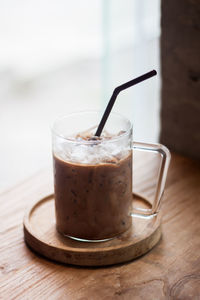 Close-up of coffee in glass on table