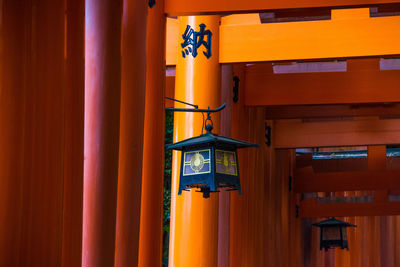 Illuminated lantern hanging in building