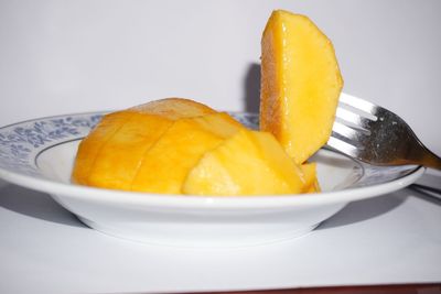 Close-up of lemon in plate