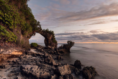 Natural bridge arch at the rocky coast of neil island in andaman islands, india