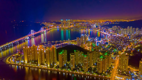 Illuminated buildings in city at night