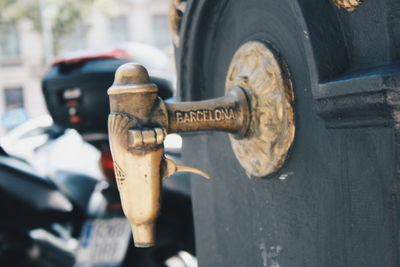 Close-up of bicycle on street in city