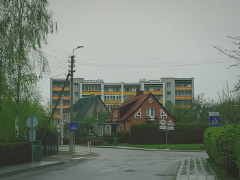 Houses against sky in city