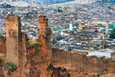 High angle view of old built structure against cityscape at fes el bali