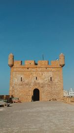 Old ruin building against blue sky