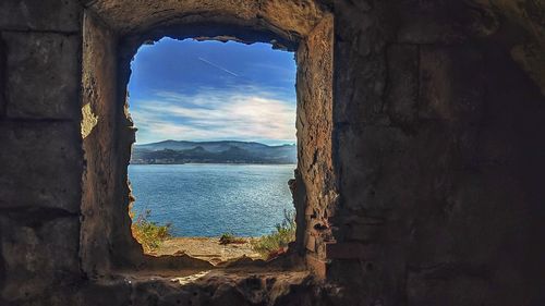 Scenic view of sea seen through window