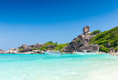 Scenic view of sea against clear blue sky