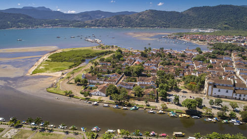 High angle view of townscape by sea