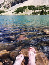 Feet of a person in shallow water