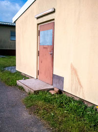 Exterior of house by building against sky