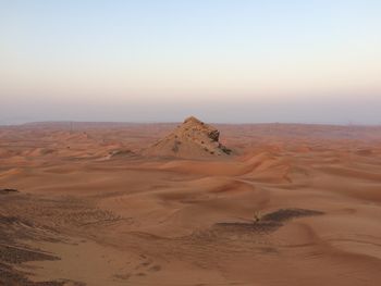 Scenic view of desert against clear sky